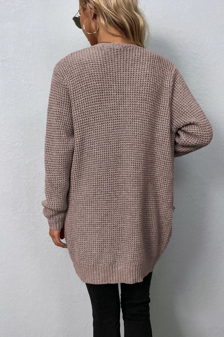 Różowy sweter z otwartym przodem