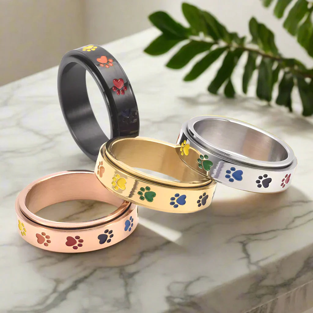 Rotating stress relief ring for paws